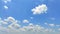 Beautiful blue sky background and beautiful white cloudy sky over the harvested rice fields. Summer sky bright and fresh.