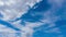 Beautiful blue sky background TimeLapse with fluffy white cirrus or cirrostratus cloud cloudscape slowly moved on daytime sky hori