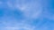 Beautiful blue sky background TimeLapse with wipe white stratus cloud cloudscape slowly moved on daytime sky horizon in tropica