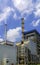 Beautiful blue sky with cloud over smokestack of power boiler in factory