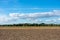 Beautiful blue sky with cloudscape over fields.