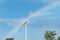 Beautiful blue sky with a rainbow and a Swedish flag stick