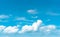 Beautiful blue sky and white cumulus clouds abstract background. Cloudscape background. Blue sky and fluffy white clouds on sunny