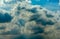 Beautiful blue sky and white cumulus clouds abstract background. Cloudscape background. Blue sky and fluffy white clouds on sunny