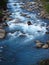 Beautiful blue water in the river in the green valle