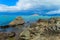 Beautiful blue water and rocks lake coast