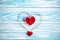 Beautiful blue wooden background with red hearts. Best card for Valentine`s day.