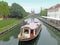 Beautiful Boat Sailing Along The Canal In The Sunny Day