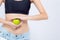 Beautiful body woman sexy slim holding green apple with cellulite for wellness, girl with fitness for weight loss and healthy