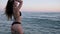 Beautiful body of young girl, young female swims in summer, girl bathes in sea,