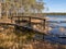 Beautiful bog landscape, curved wooden bridge over ditch