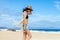 Beautiful boho styled woman posing on the beach in Canary Island