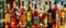 Beautiful bokeh from a row of alcoholic bottles in backlight