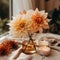 A beautiful bouquet of autumn dahlias on the table. Cozy hygge composition in Scandinavian style