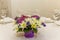 Beautiful bouquet of flowers on the table. Festive decoration of the banquet. Space for text