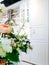 Beautiful bouquet of flowers in a vase in a modern kitchen in bright colors.