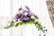 Beautiful bouquet in a glass vase. Purple and white flowers. The