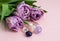 A beautiful bouquet of lilac tulips with natural stones of amethyst, rose quartz and rock crystal. Flowers and semi-