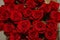 Beautiful bouquet of red roses, seen from above. Spring flowers. Wedding, women`s day, mothers day and valentines day background.