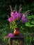 beautiful bouquet summer flowers Ivan-tea or blooming Sally in rays of evening sun. Medicinal plant willow-grass in vase