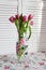 Beautiful bouquet of tulips. Glass vase. Pink tulips. Postcard.