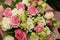 Beautiful bouquet of white and pink roses in blurry focus for background, inscription and postcard.