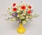 Beautiful bouquet of wild flowers daisies, poppies and consolida regalis in a vase on white