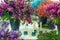 Beautiful bouquets with small matthiola flowers in the interior with candles on the table. Interior of the pavilion for the sale