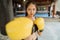 a beautiful boxer with yellow boxing gloves standing with punching moves