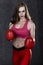 Beautiful boxing girl in red box gloves
