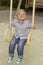 Beautiful boy in the playground smiling