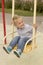 Beautiful boy in the playground smiling