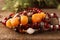 Beautiful bracelets with gemstones on wooden surface, closeup