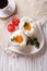Beautiful breakfast: eggs Orsini and coffee vertical top view