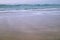 Beautiful breaking waves on sandy beach on atlantic ocean, basque country, france