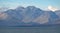 A beautiful breathtaking scene of a massive mountain range and peaceful lake from University of Canterbury Mt John Observatory, Mt