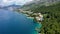 Beautiful Brela on Makarska riviera, Croatia. Adriatic Sea with amazing turquoise clean water and white sand. Aerial view of Brela