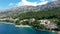 Beautiful Brela on Makarska riviera, Croatia. Adriatic Sea with amazing turquoise clean water and white sand. Aerial view of Brela