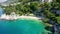 Beautiful Brela on Makarska riviera, Croatia. Adriatic Sea with amazing turquoise clean water and white sand. Aerial view of Brela