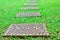 Beautiful brick blocks with flowers on the grass.