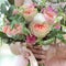 Beautiful bridal bouquet in hands of the bride. Wedding bouquet of peach roses by David Austin, single-head pink rose aqua,