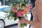 Beautiful bridal bouquet in hands of the bride. Wedding bouquet of peach roses by David Austin, single-head pink rose aqua, eucal