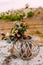 The Beautiful bridal bouquet on a wooden stand outdoors. Wedding floristic decoration.