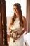 Beautiful Bride In Bedroom Looking at Mirror