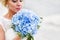 Beautiful bride with blue wedding bouquet