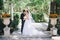 Beautiful bride and groom posing in a yard of a castle