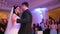 Beautiful bride and handsome groom dancing first dance at the wedding party