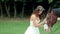Beautiful Bride and Her Horse on Grass Area