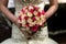 Beautiful bride holds wedding bouquet