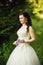 Beautiful bride in luxurious wedding dress in purple lavender fl